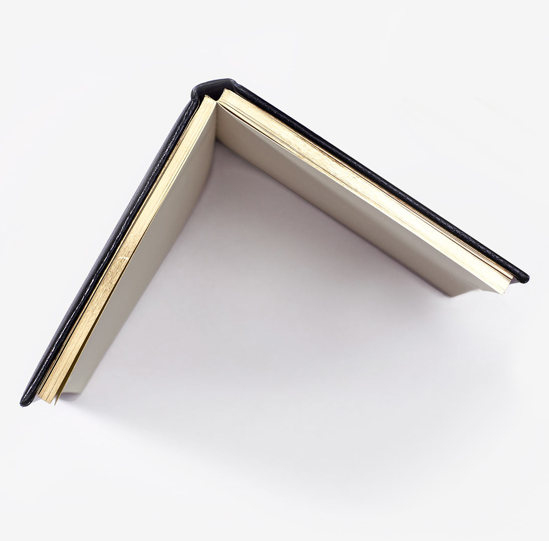 gilt-edging-w Open notebook with gold edging