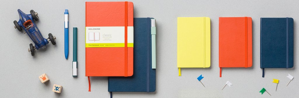Set of diferent sizes and colours Moleskine Classic Notebooks