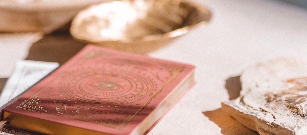Magic of I dream journal in coral with holographic foil branding on the cover