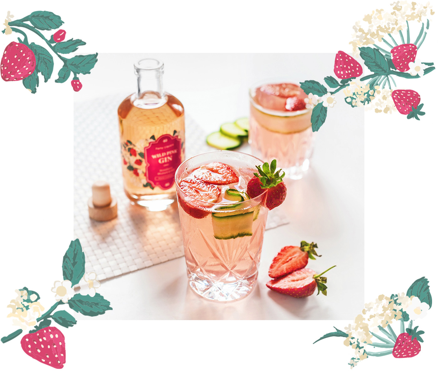 Wild Pin Gin pictured in a glass with fruit and strawberry decoration in pinks