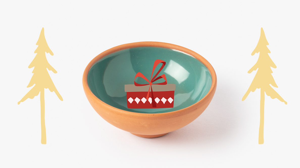 Turquoise trinket dish with golden trees and christmas present decorations