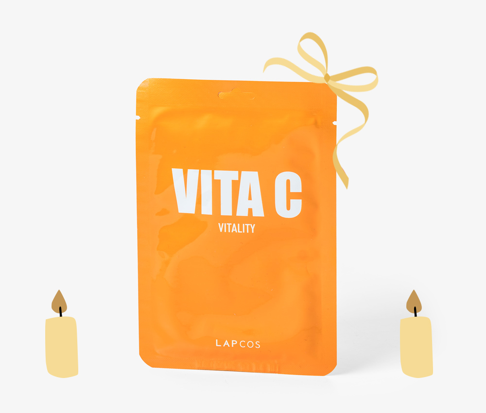 Vita C Vitality Skin Mask with gold candles and bow decoration