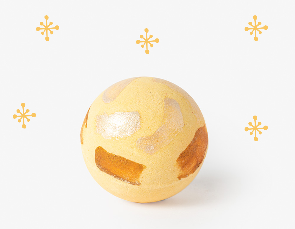Citrus Twist Bath Bomb with golden star decorations