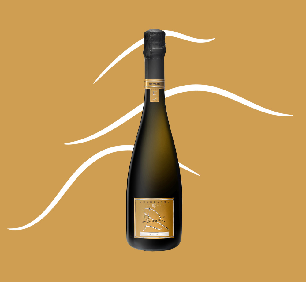 Cuvée Aged 5 Years Champagne with gold yellow background and white swirly shapes